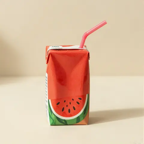 Kids juice drink box with a straw
